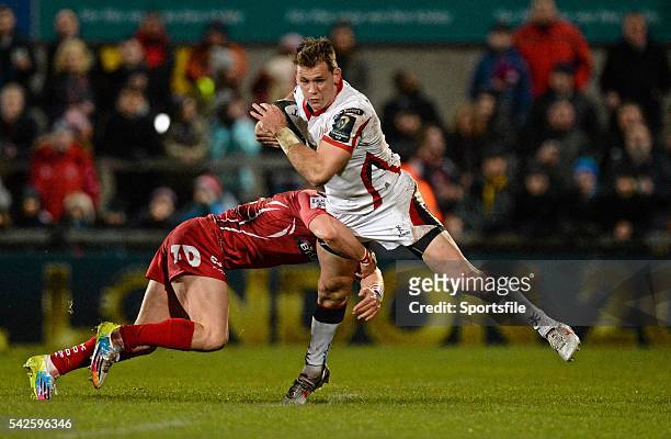 December 2014; Craig Gilroy, Ulster, is tackled by Harry Robinson, Scarlets. European Rugby Champions Cup 2014/15, Pool 3, Round 3, Ulster v...