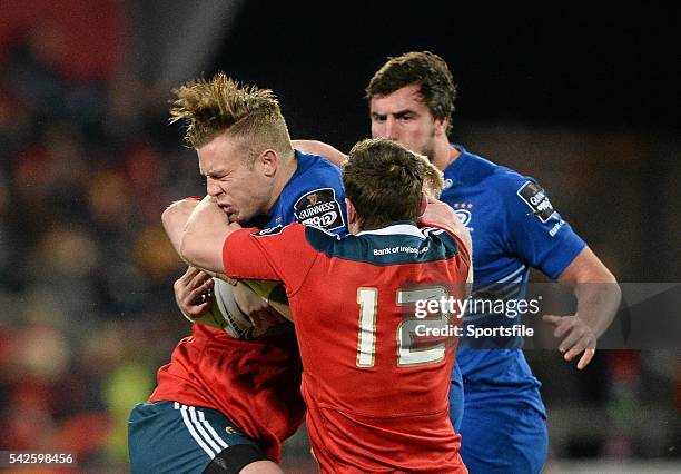 December 2014; Ian Madigan, Leinster, is tackled by Denis Hurley and Stephen Archer, Munster. Guinness PRO12, Round 11, Munster v Leinster, Thomond...