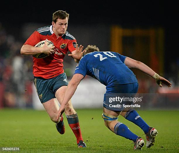 December 2014; Denis Hurley, Munster, is tackled by Luke McGrath, Leinster. Guinness PRO12, Round 11, Munster v Leinster, Thomond Park, Limerick....