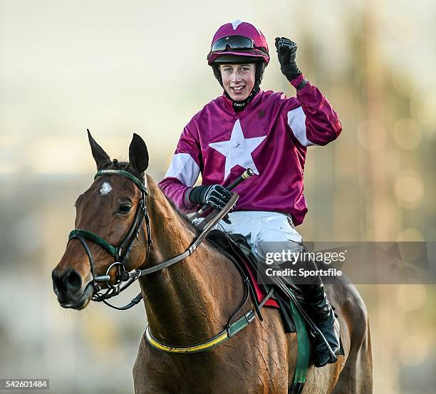 December 2014; Jockey Bryan Cooper celebrates after his mount Road To Riches won the Lexus Steeplechase. Leopardstown Christmas Festival,...