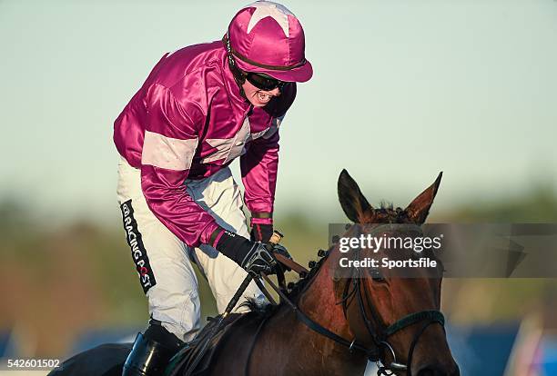 December 2014; Jockey Bryan Cooper celebrates as his mount Road To Riches crosses the finish line to win the Lexus Steeplechase. Leopardstown...