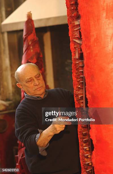 Battaglia artistic foundry, in Milan. This is the foundry where the works by Italian sculptor Arnaldo Pomodoro are made. The artist working on a wax...