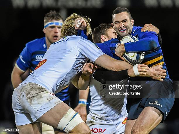 January 2015; Dave Kearney, Leinster, is tackled by Richie Gray, left, and Rory Kockott, Castres. European Rugby Champions Cup 2014/15, Pool 2, Round...