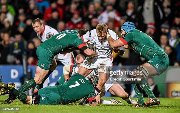 January 2015; Luke Marshall, Ulster, is tackled by Freddie Burns, left, Julian Salvi, centre, and Graham Kitchener, Leicester Tigers. European Rugby...