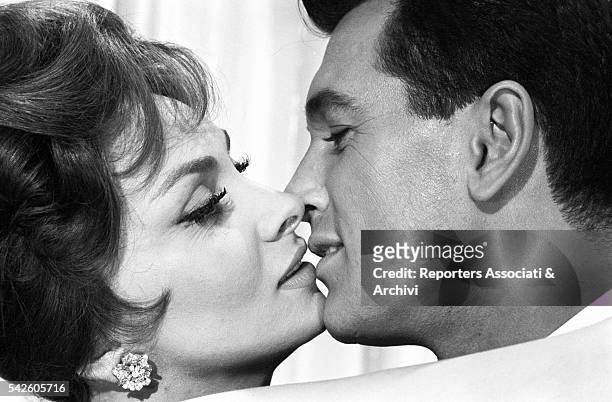 American actor Rock Hudson kissing Italian actress Gina Lollobrigida in Come September. Italy, 1960