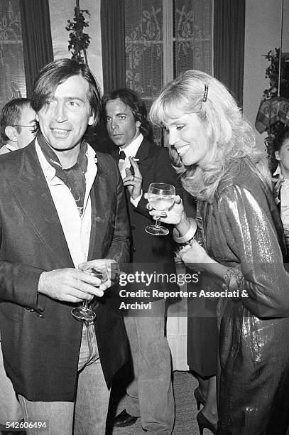 French showgirl Amanda Lear and her husband Alain-Philippe Malagnac at a cocktail. Paris, 1979