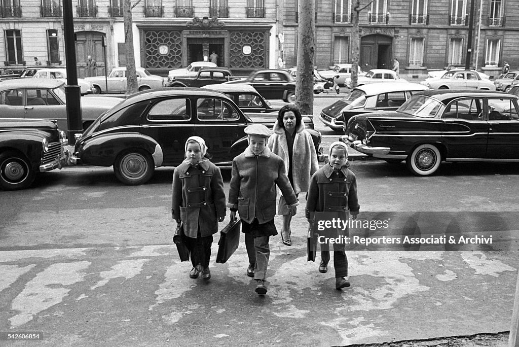 Roberto jr, Isabella and Isotta Ingrid Rossellini coming out of school