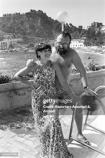 Italian director Sergio Leone in a swimming pool with his wife Carla. 1972