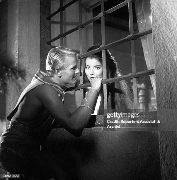 French actress Jacqueline Sassard talking to Italian actor Giuliano Gemma through a grill in My Son, the Hero. 1961