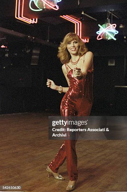 French showgirl Amanda Lear dancing in a club in Follie di notte. Rome, 1978