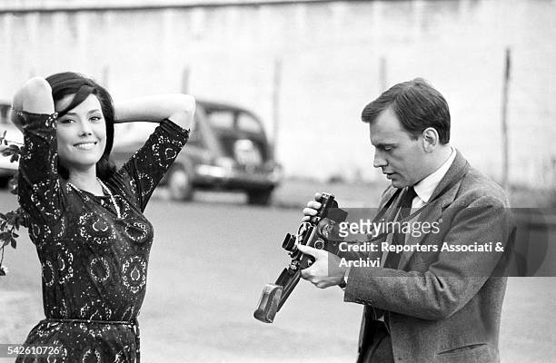 French actor Jean-Louis Trintignant taking a picture of Italian actress Grazia Maria Spina . Rome, 28th March 1963