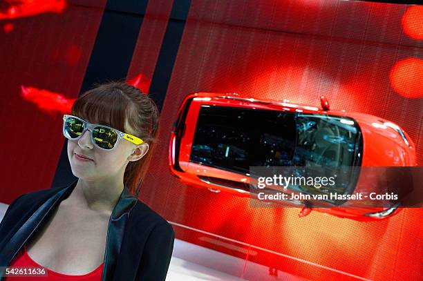 Hostess at the Opel Vauxhall Corsa stand. World's largest automobile exposition, the 2014 Paris Motor Show, Mondial de l'Automobile, gets under way...