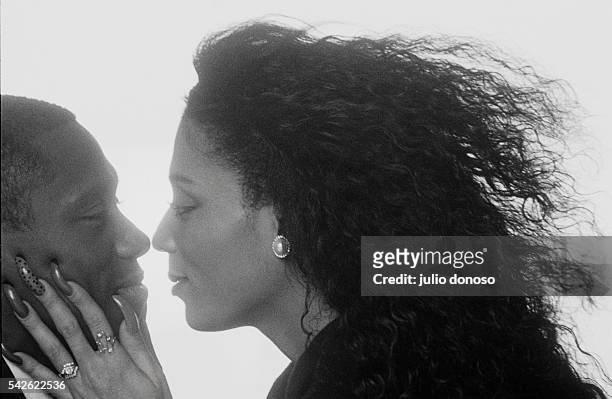 Olympic runner Florence Griffith Joyner embraces her husband, coach and triple jump champion Al Joyner. Flo Jo won the gold medal in the 1988 Olympic...