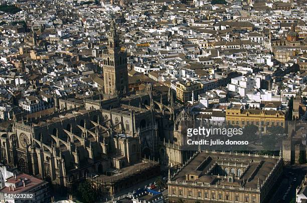 The Seville Cathedral and its bell tower, La Giralda, dominate the Seville skyline. At lower right is the Archivo General de Indias.