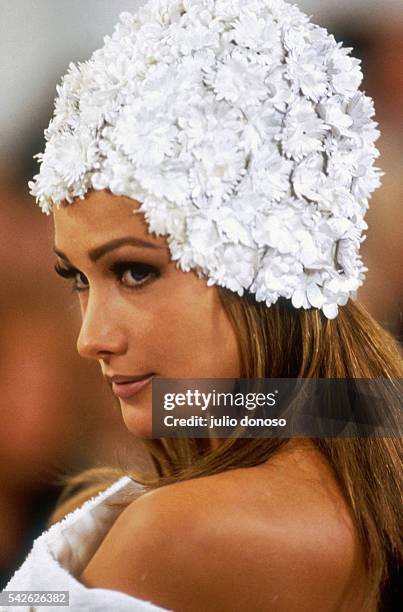 Supermodel Carla Bruni models an outfit from Italian design house Prada's ready-to-wear collection during the spring-summer 1992 fashion show in...