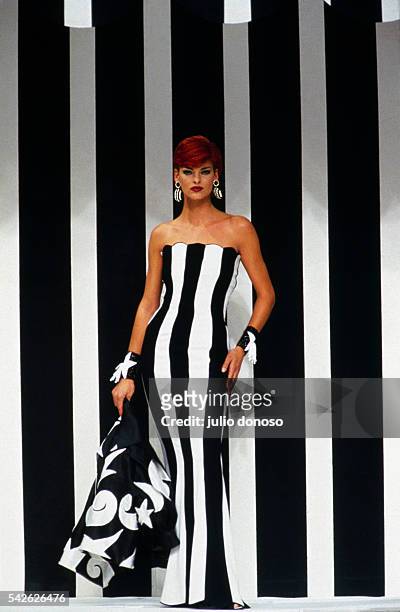 Canadian supermodel Linda Evangelista wears a black-and-white ready-to-wear evening gown with a matching jacket by designer Valentino Garavani for...