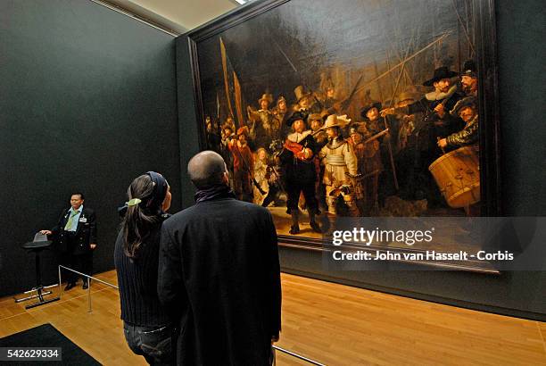 Vistitor looking at a painting in the Rijksmuseum in Amsterdam as the Netherlands gears up to celebrate the 400th anniversary of the birth of...