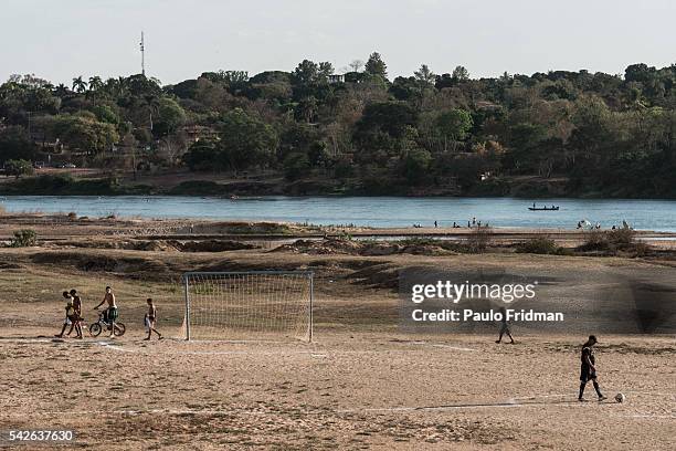 People play soccer on the dry areas left by the drought of Sao Francisco river. Pirapora, Minas Gerais, Brazil, October 11th 2014.