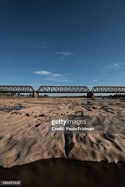 View of the drought at the Sao Francisco river with the bridge on the background. Pirapora, Minas Gerais, Brazil, October 11th 2014.