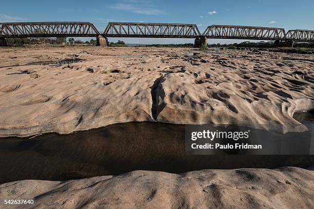 View of the drought at the Sao Francisco river with the bridge on the background. Pirapora, Minas Gerais, Brazil, October 11th 2014.
