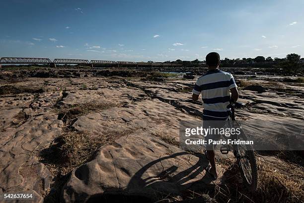 Man walks around the areas which were affected by the drought of Sao Francisco river. Pirapora, Minas Gerais, Brazil, October 11th 2014.