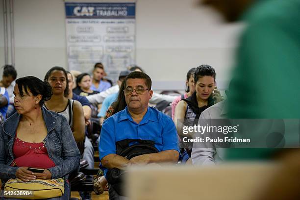 People wait to be served at CAT Centro de Apoio ao Trabalho, Sao Paulo, Brazil on August 31st, 2015