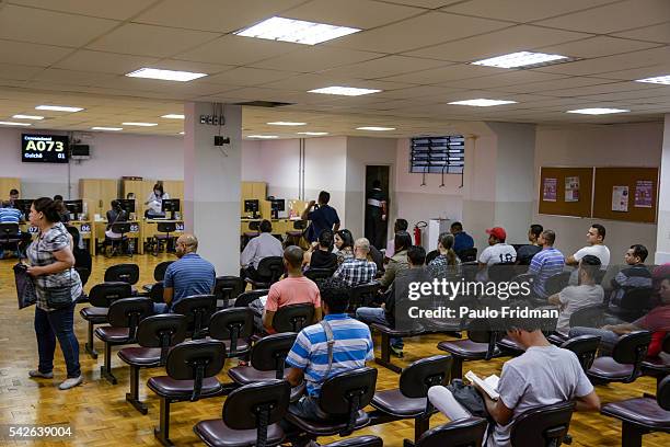 People wait to be served at CAT Centro de Apoio ao Trabalho, Sao Paulo, Brazil on August 31st, 2015