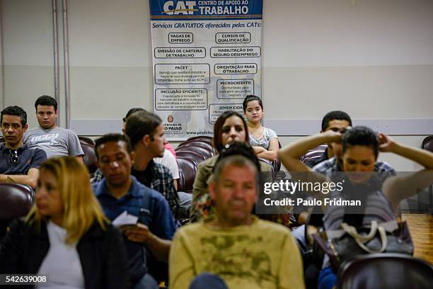 People wait to be served regarding unemployment insurance And job vacancies at the CAT Central de Apoio ao Trabalhador, Sao Paulo, Brazil on August...