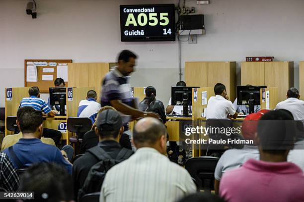 People wait to be served at CAT Centro de Apoio ao Trabalho, Sao Paulo, Brazil on August 31st, 2015