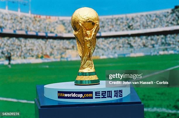 The world cup trophy made of 18 carat was created in 1978 by Italian sculptor Silvio Gazzaniga and is 36 cm tall and weighs 5 kg.