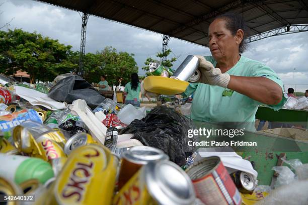 Workers separate trash from aluminium for recycling at Cooperativa de Trabalho Moreira Recicla in Pindamonhangaba, Brazil, on Wednesday, Nov. 4,...