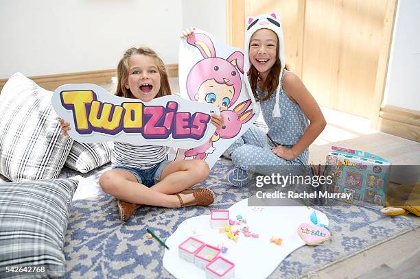 Actress Aubrey Anderson-Emmons and friend Raegan Revord preview Twozies, a new toy line from the makers of Shopkins at AU FUDGE on June 22, 2016 in...