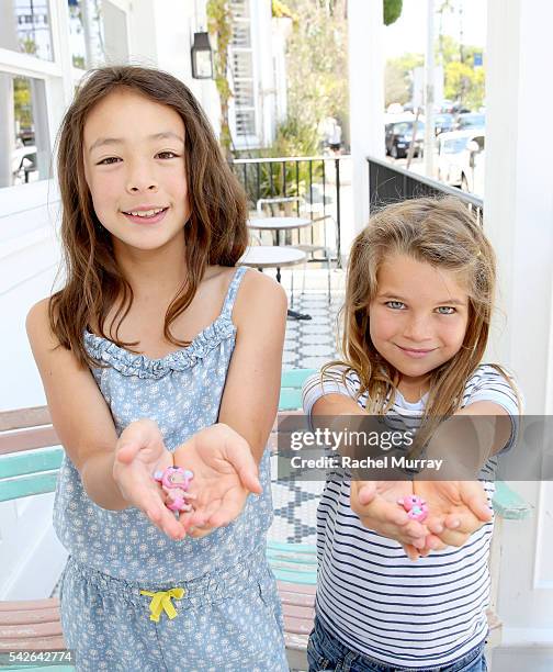 Actress Aubrey Anderson-Emmons and friend Raegan Revord preview Twozies, a new toy line from the makers of Shopkins at AU FUDGE on June 22, 2016 in...