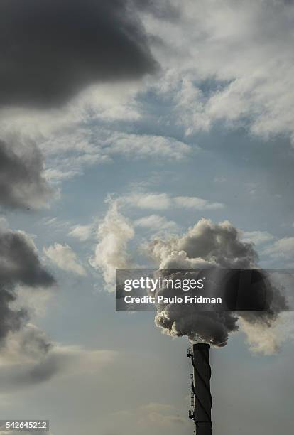 Vapor steam billows from chimneys at At Unidade industrial Cruz Alta da Guarani SA ethanol sugar and energy , about 40 km from Sao Jose do Rio Preto...