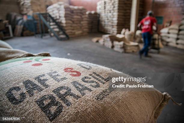Carries bags of coffee beans that are going to be roasted at Café Primavera, Itapira, Brazil, on Monday , February 10TH