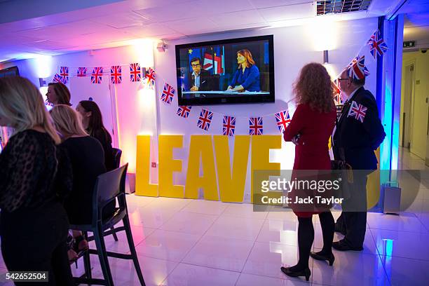 People watch the EU referendum coverage at the Leave.EU campaign's referendum party at Millbank Tower on June 23, 2016 in London, England. The United...