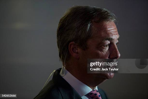 Independence Party Leader Nigel Farage waits to speak to media at the Leave.EU campaign's referendum party at Millbank Tower on June 23, 2016 in...