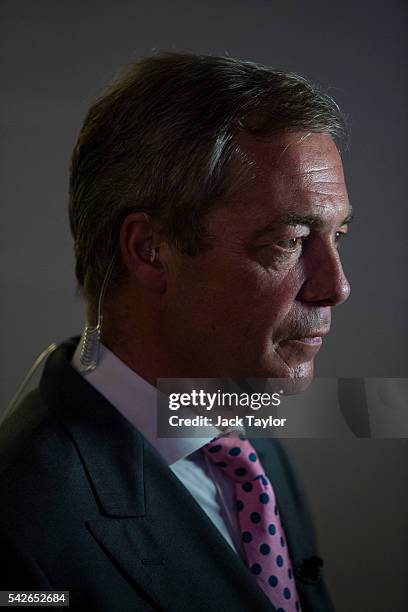 Independence Party Leader Nigel Farage waits to speak to media at the Leave.EU campaign's referendum party at Millbank Tower on June 23, 2016 in...