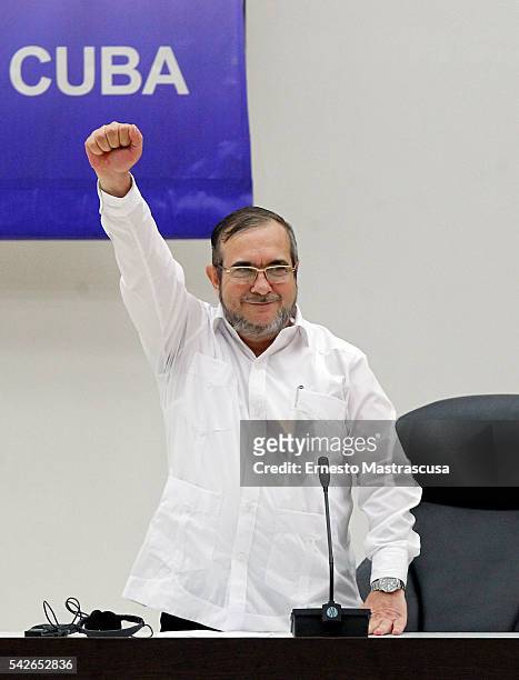 Timoleon Jimenez "Timonchenko" raises his fist during a meeting to announce the Ceasefire Agreement between Colombian Government and the FARC rebels...