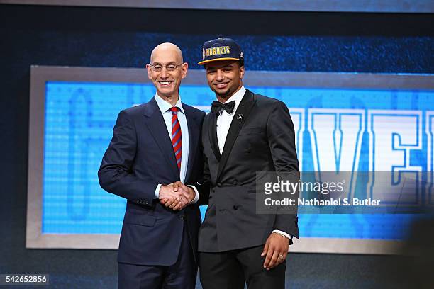 Jamal Murray shakes hands with NBA Commissioner Adam Silver after being selected number seven overall by the Denver Nuggets during the 2016 NBA Draft...