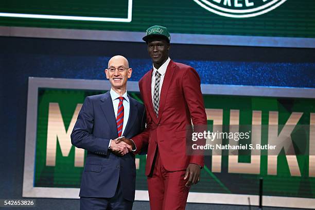 Thon Maker shakes hands with NBA Commissioner Adam Silver after being selected number ten overall by the Milwaukee Bucksduring the 2016 NBA Draft on...