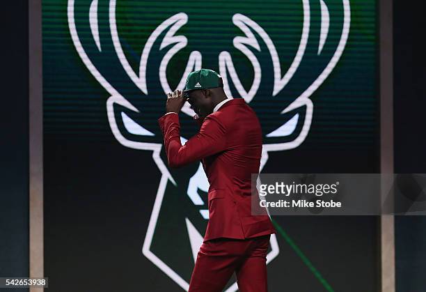 Thon Maker walks on stage after being drafted 10th overall by the Milwaukee Bucks in the first round of the 2016 NBA Draft at the Barclays Center on...