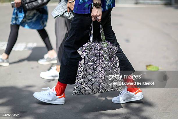 A guest is seen, after the Issey Miyake Men show, during Paris News  Photo - Getty Images