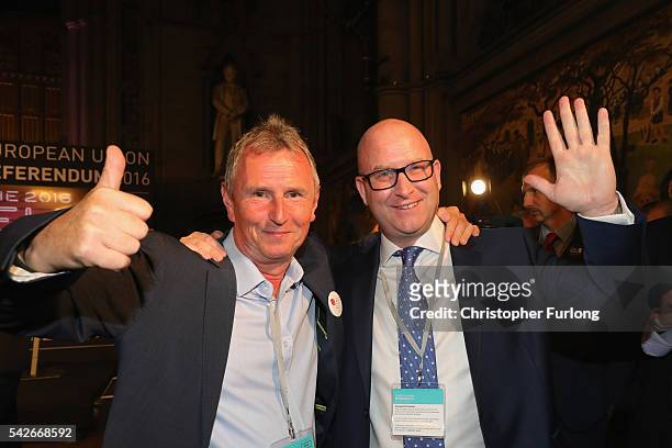 Paul Nuttal MEP and Nigel Evans MP of Vote Leave celebrate as positive results come in from the counts before the official referendum announcement at...