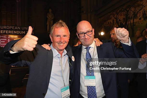 Paul Nuttal MEP and Nigel Evans MP of Vote Leave celebrate as positive results come in from the counts before the official referendum announcement at...