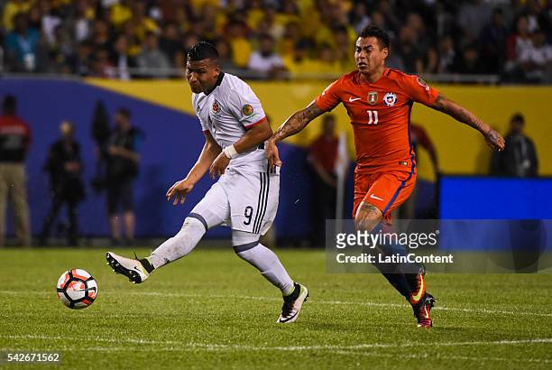 Roger Martinez of Colombia and Eduardo Vargas of Chile fight for the ball during a Semifinal match between Colombia and Chile at Soldier Field as...