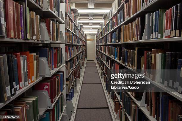 Shelves full of books on C-level, the lowest floor of the Milton S. Eisenhower Library on the Homewood campus of the Johns Hopkins University in...