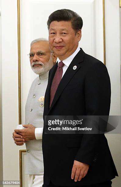 Indian Prime Minister Narendra Modi and Chinese President Xi Jinping arrives at the sessionn of Shanghai Cooperation Organisation Summit on June 24,...