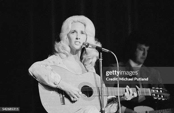 American country music singer-songwriter Tammy Wynette performing at the Hammersmith Odeon, London, June 1975.