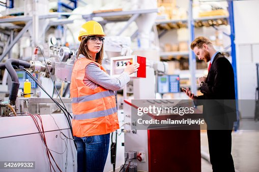 Quality Control Operative Female Worker With Quality Control Inspector In The Factory High-Res ...